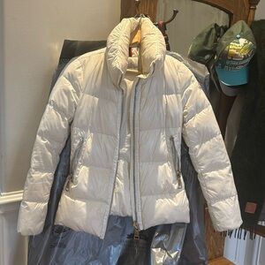Moncler white down tapered, short jacket with long sleeves. Size 1